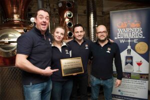 Warner's Distillery team with their B-Corp award