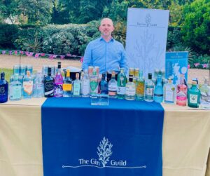 Gin Guild Director General Pal Gleed with the Guild's selection of gins at the UK Foreign and Commonwealth Development office summer