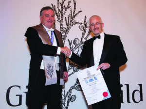 Maurice Doyle joining the Gin Guild in October 2012 (pictured with Guild Chairman, Christopher Hayman)